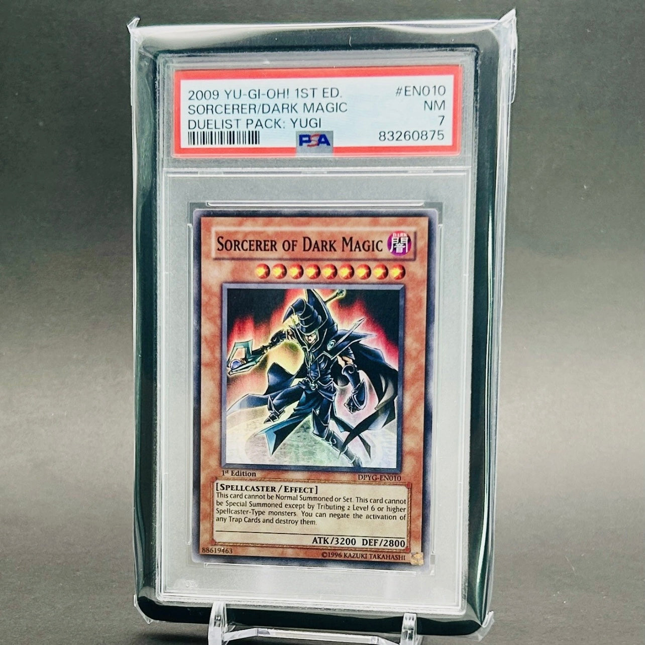 PSA 7 Yu-Gi-Oh! Sorcerer of Dark Magic 1st Edition Super Rare - DPYG-EN010 Duelist Pack: Yugi